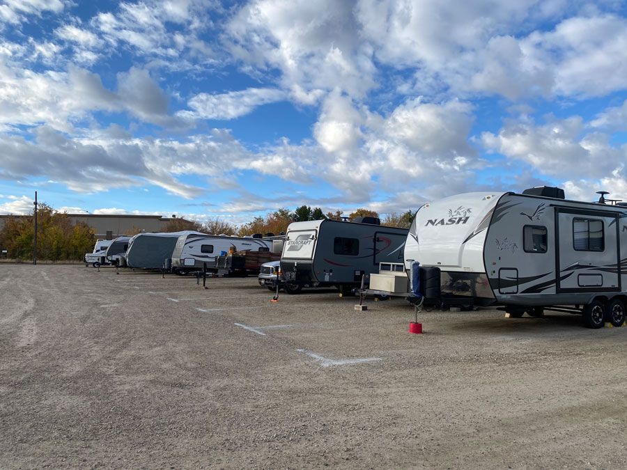 Several RVs parked in a gravel lot | Idaho Storage Connection