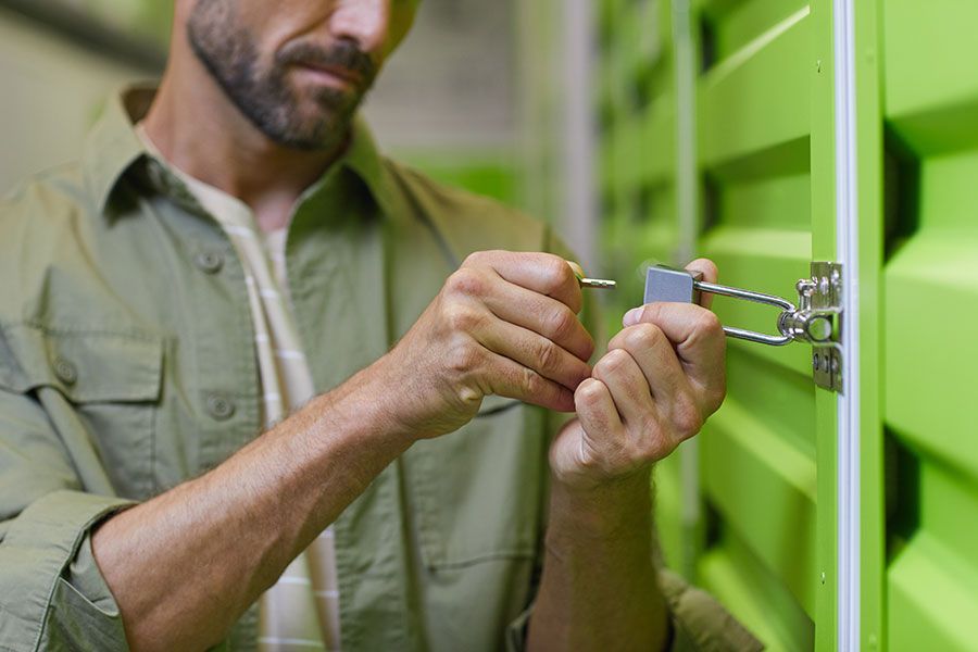 A man locking a storage unit | Idaho Storage Connection